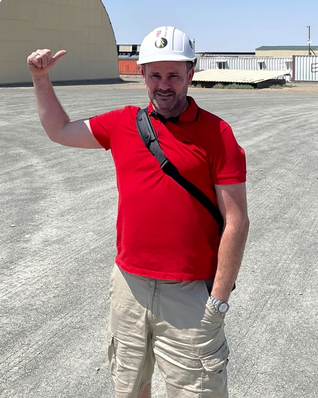 Grigoriy Kats wearing a hard hat during an on-site visit to a power-generation equipment facility